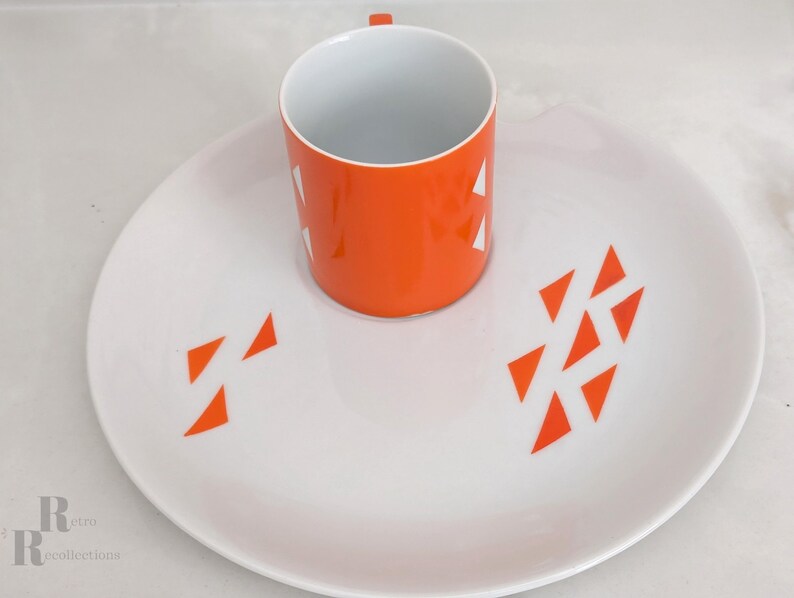 Jonas Roberts Japan snack set with white yin yang snack plate with orange diamonds and orange cup with white diamond pattern