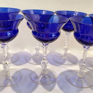 Set of 7 Antique Cobalt Royal Blue 3126 Cambridge Glass Champagne / Tall Sherbet Stemware.  Beautiful, clear cobalt blue art deco style angular flare top on a bulbous, bulging bowl with graceful foliated clear glass tall stems.