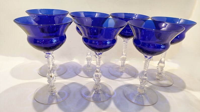 Set of 7 Antique Cobalt Royal Blue 3126 Cambridge Glass Champagne / Tall Sherbet Stemware.  Beautiful, clear cobalt blue art deco style angular flare top on a bulbous, bulging bowl with graceful foliated clear glass tall stems.