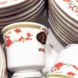 Lilily Cakara Dinnerware set, service for 8 Dinner plartes, salad plates, Soup Bowl, cup and saucer. Also Large oval platter, vegetable bowl and Covered Sugar (1)