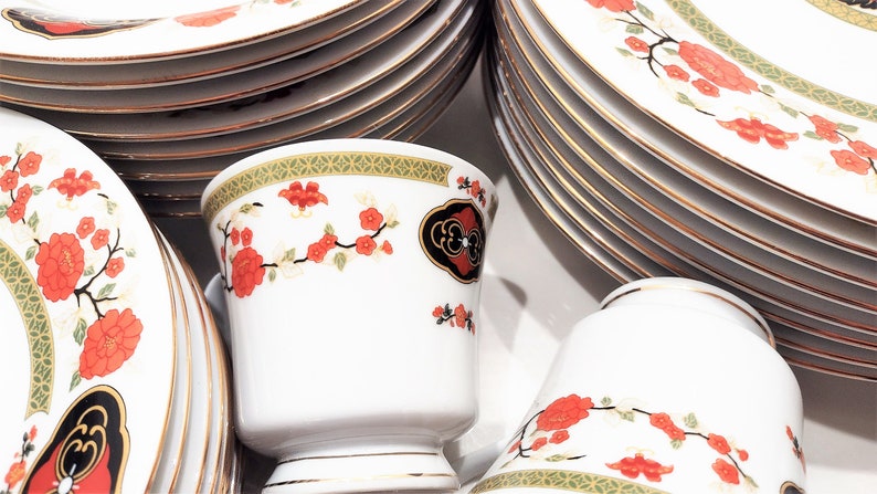 Lilily Cakara Dinnerware set, service for 8 Dinner plartes, salad plates, Soup Bowl, cup and saucer. Also Large oval platter, vegetable bowl and Covered Sugar (1)