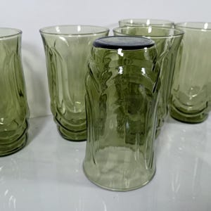 Set of 6 Vintage Anchor Hocking avodaco green tumblers. 5 1/4 inch tall glasses molded into the shape to  represent tulip blossoms.