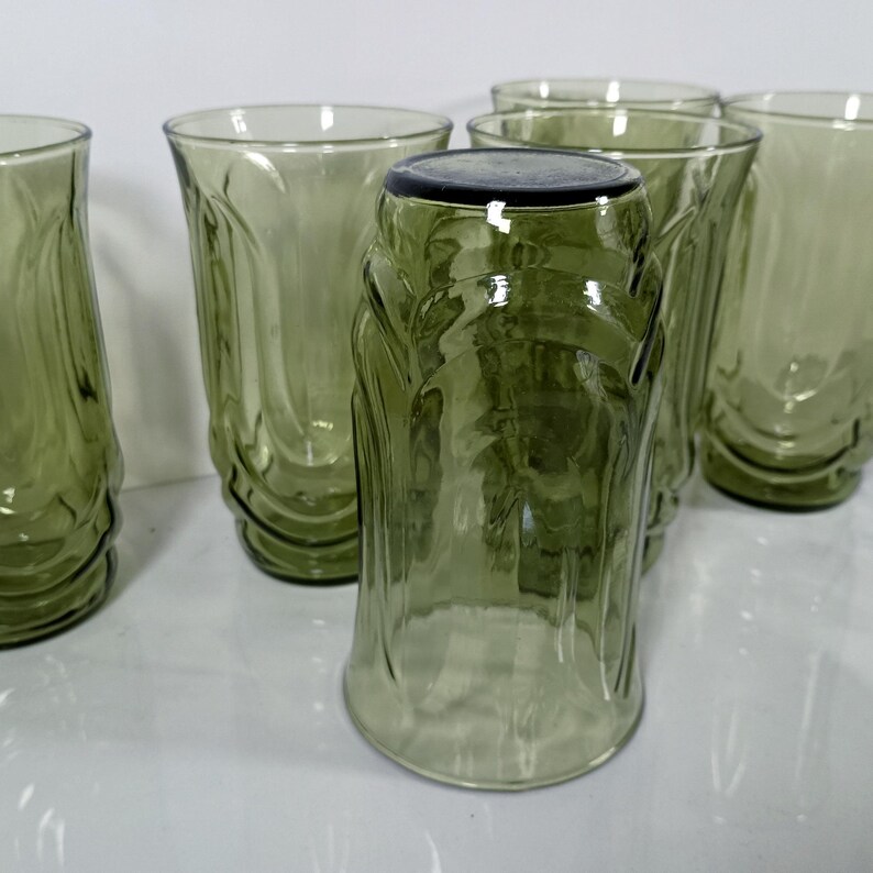 Set of 6 Vintage Anchor Hocking avodaco green tumblers. 5 1/4 inch tall glasses molded into the shape to  represent tulip blossoms.