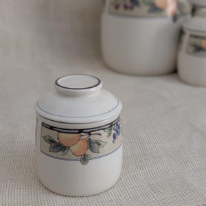 Mikasa Garden Harvest CAC29 stoneware Mini canister with fruit and leaf border on cream glaze.