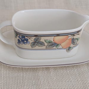 Mikasa Garden Harvest CAC29 stoneware Gravy Boad and Underplate with fruit and leaf border on cream glaze.