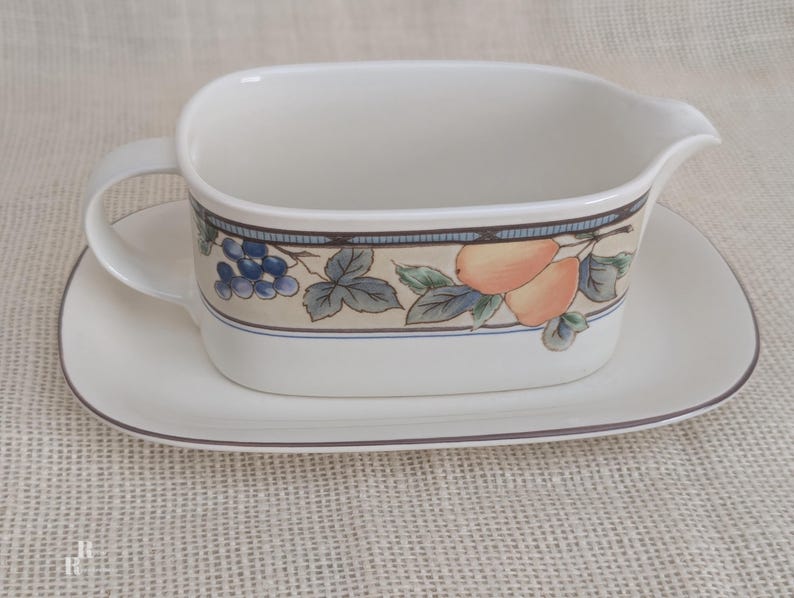 Mikasa Garden Harvest CAC29 stoneware Gravy Boad and Underplate with fruit and leaf border on cream glaze.