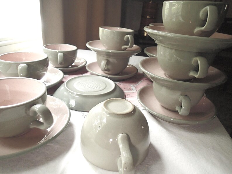Harkerware Oven Proof Shell pink dinnerware pieces. Shell pink with dove gray undersides. Mid Century Modern plates, cups and saucers sold in set