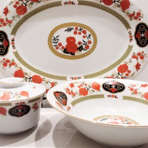 Lilily Cakara Dinnerware set, service for 8 Dinner plartes, salad plates, Soup Bowl, cup and saucer. Also Large oval platter, vegetable bowl and Covered Sugar (1)