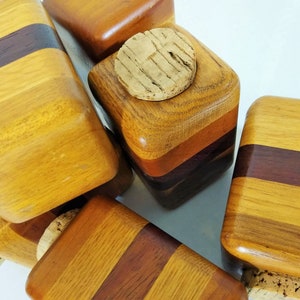 Mid Century Turned Stacked Layered Wood Spice Containers with Cork Stoppers. Set of 6 wooden spice jars  ade of Layers of various varieties of dark and light colored wood stacked together, turned, and finished to warm rich layers of natural wood.