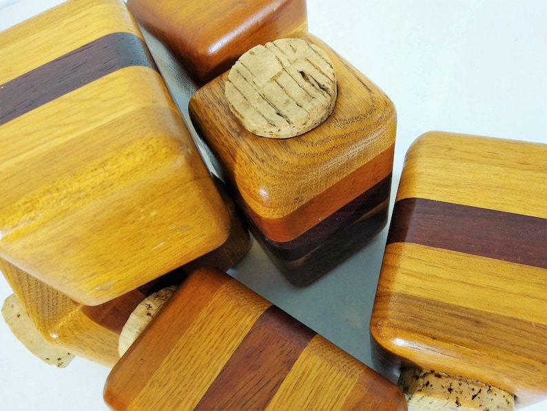 Mid Century Turned Stacked Layered Wood Spice Containers with Cork Stoppers. Set of 6 wooden spice jars  ade of Layers of various varieties of dark and light colored wood stacked together, turned, and finished to warm rich layers of natural wood.