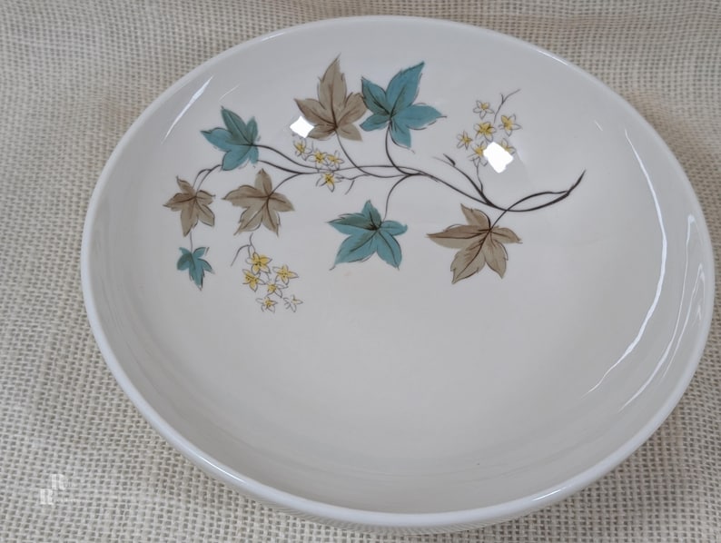 Mid‑century Syracuse China Woodbine serving bowl with the aqua and brown floral motif on a bright white glaze.