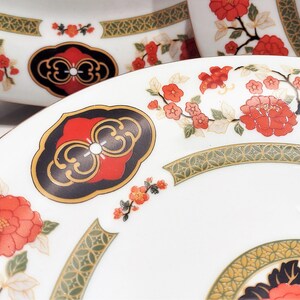 Lilily Cakara Dinnerware set, service for 8 Dinner plartes, salad plates, Soup Bowl, cup and saucer. Also Large oval platter, vegetable bowl and Covered Sugar (1)