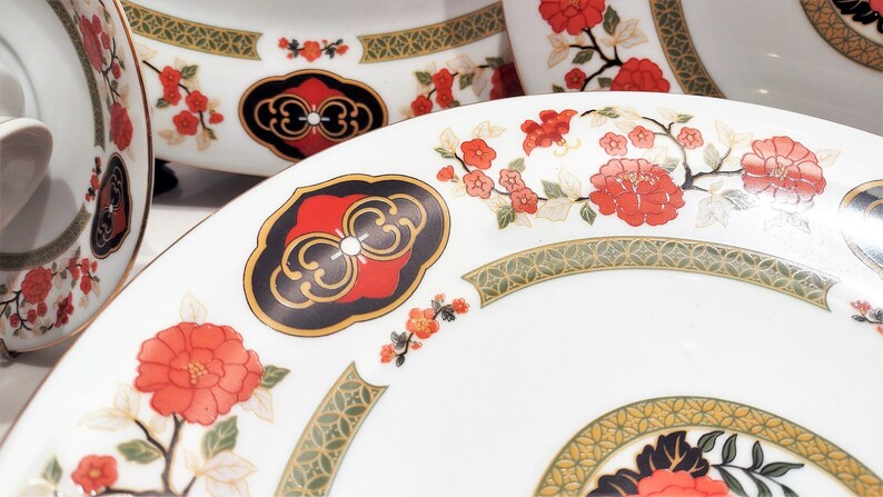 Lilily Cakara Dinnerware set, service for 8 Dinner plartes, salad plates, Soup Bowl, cup and saucer. Also Large oval platter, vegetable bowl and Covered Sugar (1)