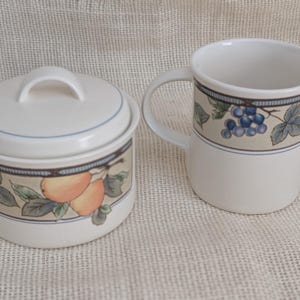 Mikasa Garden Harvest CAC29 stoneware Covered Sugar and Creamer with fruit and leaf border on cream glaze.