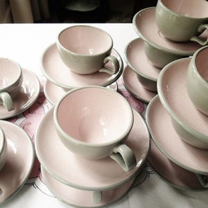 Harkerware Oven Proof Shell pink dinnerware pieces. Shell pink with dove gray undersides. Mid Century Modern plates, cups and saucers sold in set
