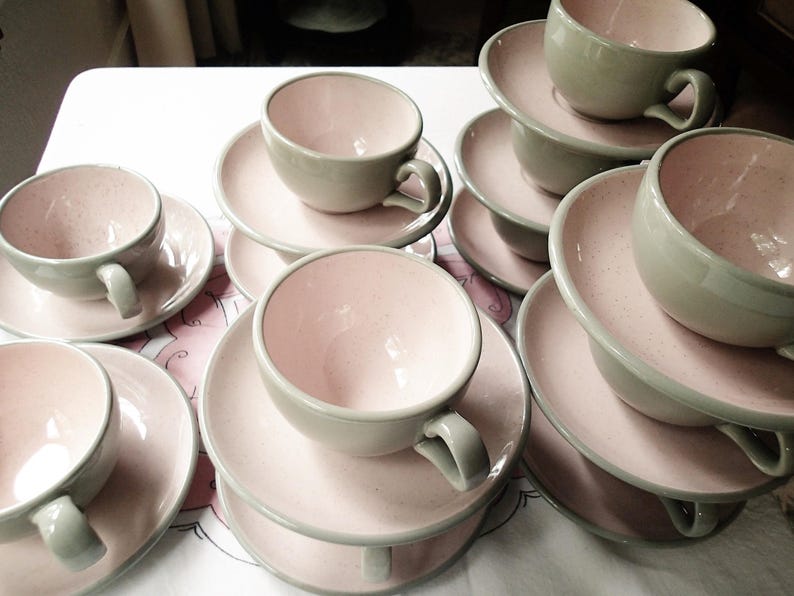 Harkerware Oven Proof Shell pink dinnerware pieces. Shell pink with dove gray undersides. Mid Century Modern plates, cups and saucers sold in set