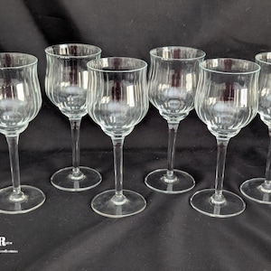 May include: A rustic wooden sign with the text "Welcome to our home" in white lettering. The sign features a distressed finish and a simple, inviting design, perfect for front door decor.