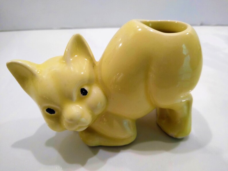 Antique Yellow Cat Figurine Perfume Diffusers. Sometimes listed as Antique Toothbrush or toothpick Holder, however it was likely originally made as perfume diffusers