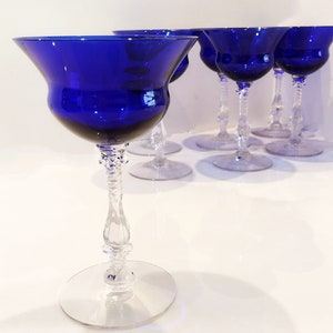 Set of 7 Antique Cobalt Royal Blue 3126 Cambridge Glass Champagne / Tall Sherbet Stemware.  Beautiful, clear cobalt blue art deco style angular flare top on a bulbous, bulging bowl with graceful foliated clear glass tall stems.