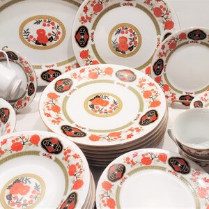 Lilily Cakara Dinnerware set, service for 8 Dinner plartes, salad plates, Soup Bowl, cup and saucer. Also Large oval platter, vegetable bowl and Covered Sugar (1)