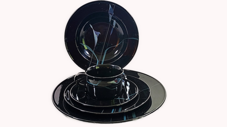 Mikasa Galleria Opus Black five piece place setting. Mystical Calla Lilys on black dinner plate, salad plate, soup bowl, cup and saucers.