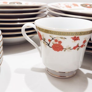 Lilily Cakara Dinnerware set, service for 8 Dinner plartes, salad plates, Soup Bowl, cup and saucer. Also Large oval platter, vegetable bowl and Covered Sugar (1)