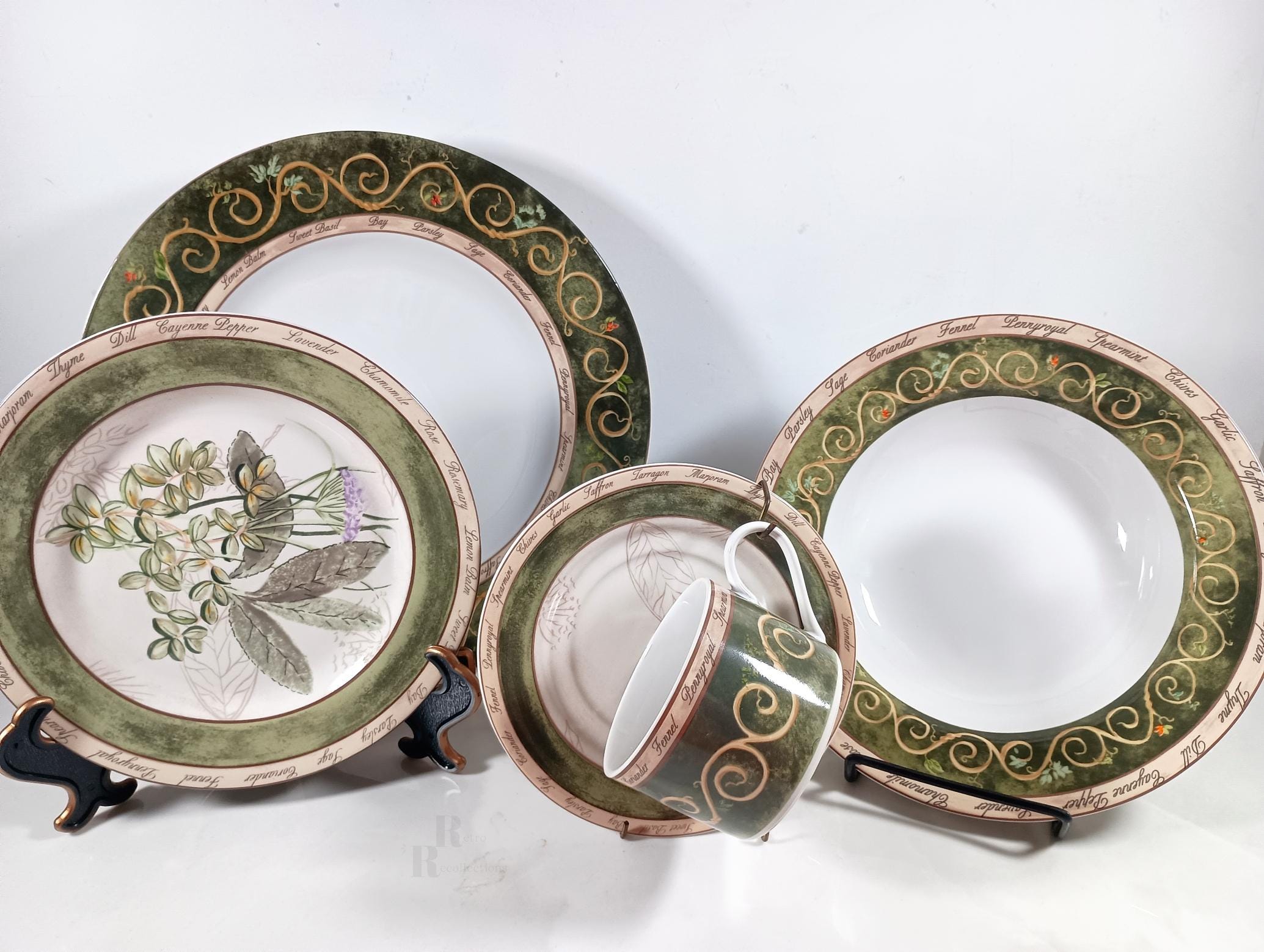 American Atelier Bouquet Garni Tuscan style dinnerware, avocado green, tan scrolls. 20-piece service for 4, sets of 6 or 8 cups with saucers