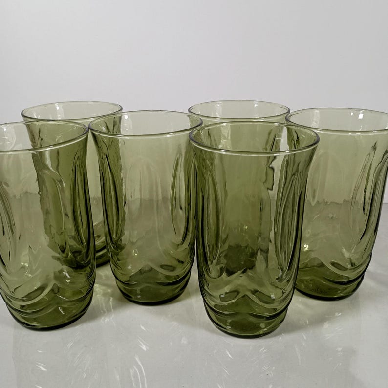 Set of 6 Vintage Anchor Hocking avodaco green tumblers. 5 1/4 inch tall glasses molded into the shape to  represent tulip blossoms.