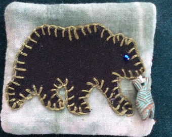 Bear with fish pin brooch