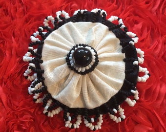 Black and white beaded pin brooch