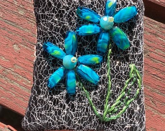 Vivid flowers on silver mesh and black velvet pin brooch