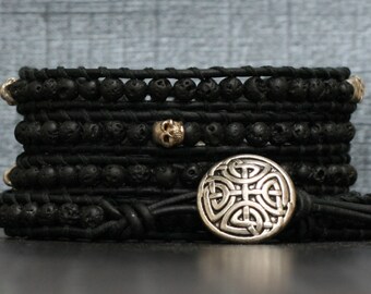 wrap bracelet- silver skulls and black lava on black leather
