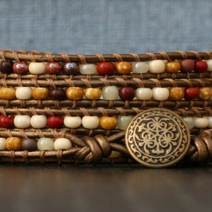 beaded leather wrapped bracelet - warm fall tones - brown, ochre, cream and red glass beads on bronze leather - bohemian jewelry