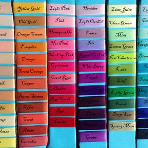 May include: A chart of 100 different color swatches with their names written in black text. The swatches are arranged in 10 rows of 10 swatches each. The colors range from white to black, with shades of pink, red, orange, yellow, green, blue, purple, brown, and gray.