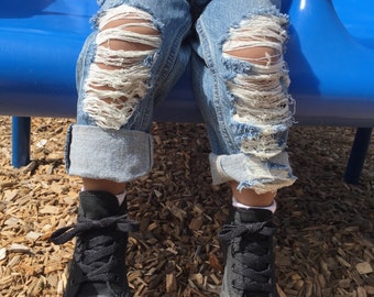 light blue jeans with holes