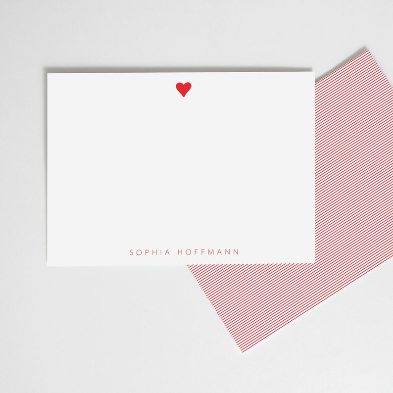 May include: White stationery card with a red heart in the top center and the name "SOPHIA HOFFMANN" printed in red at the bottom. The card is paired with a red and white striped envelope.