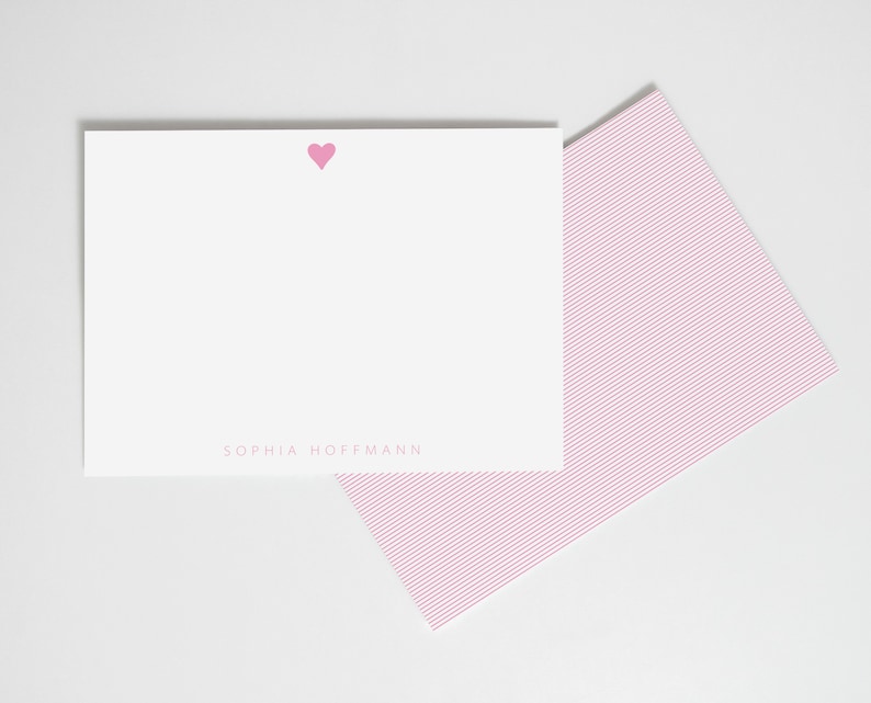 May include: Pink stationery set with a small pink heart and the name "Sophia Hoffman" printed on the front.