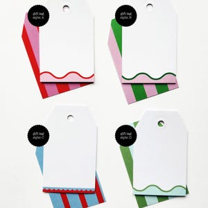 May include: Four white gift tags with scalloped or wavy edges and colorful striped accents. Each tag has a black circular label with the text "gift tag style: A, B, C, or D". The tags are designed for gift giving.