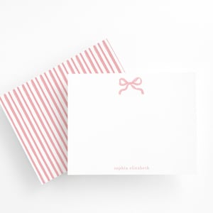 Elegant personalized stationery with pink bow design, striped back, and envelopes. Perfect gift for girls, women, or note lovers