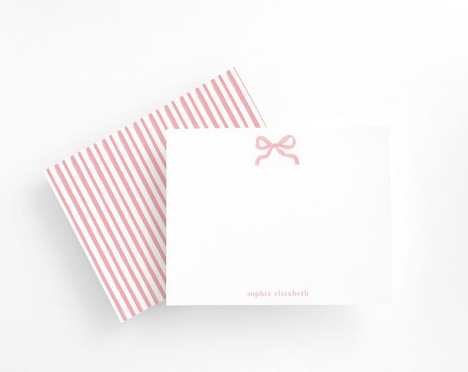 Elegant personalized stationery with pink bow design, striped back, and envelopes. Perfect gift for girls, women, or note lovers