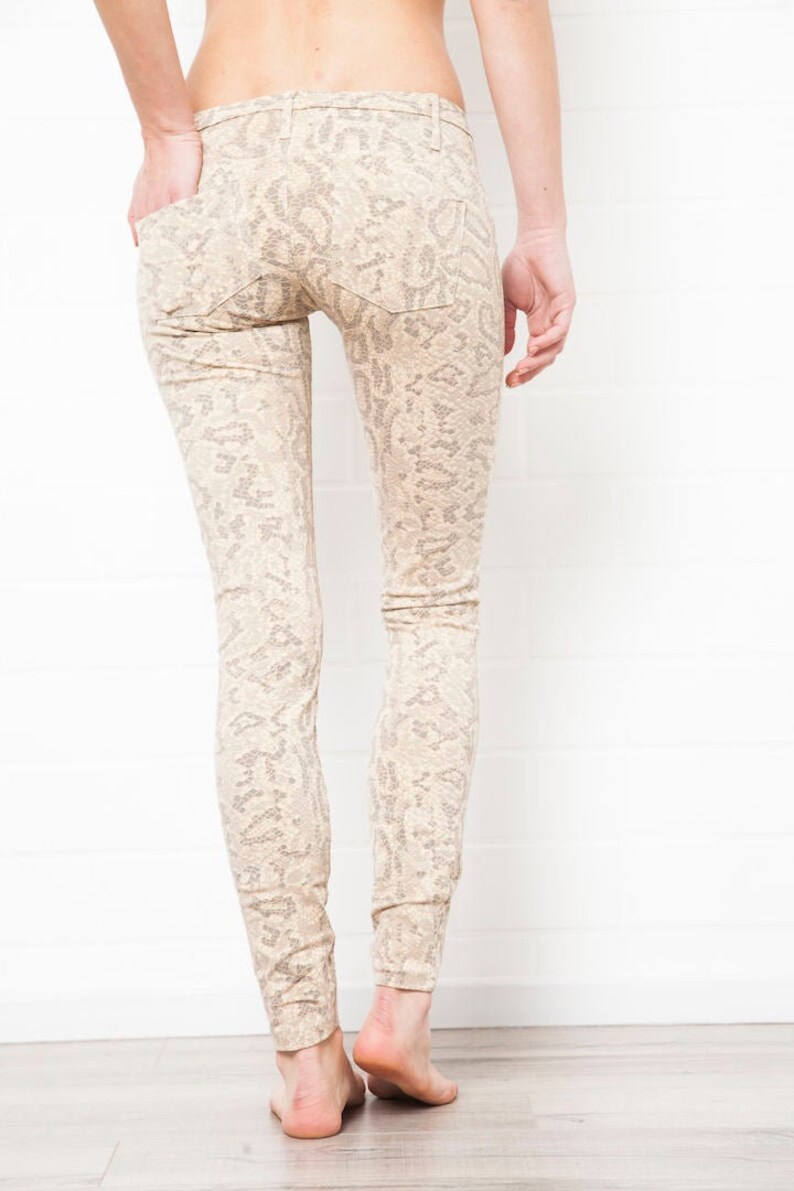 cream snake print jeans