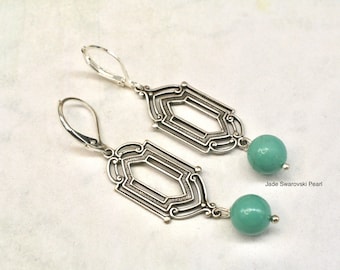 May include: Silver filigree earrings with a teal jade Swarovski pearl drop.