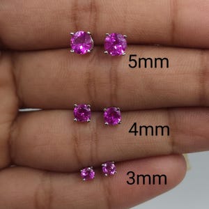 May include: Three pairs of pink gemstone earrings in different sizes. The earrings are 5mm, 4mm, and 3mm in diameter.