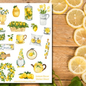 May include: A sheet of lemon-themed stickers featuring a variety of illustrations, including lemons, a pitcher of lemonade, a gnome, a tea pot, a rolling pin, a wreath, a bicycle, and a sign that says "Lemon".