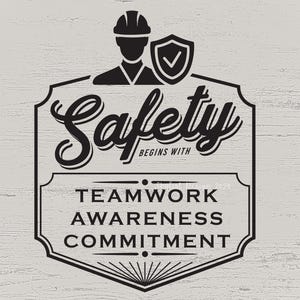 May include: Black and white graphic design with a safety theme. The graphic features a construction worker wearing a hard hat and a check mark inside a shield. The text reads "Safety Begins With Teamwork Awareness Commitment".