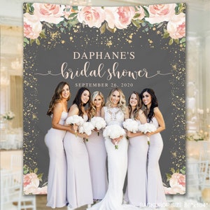 May include: A bridal shower backdrop with a group of women in pale dresses holding bouquets. The backdrop is grey with floral and gold accents, and the text "Daphane's bridal shower" is displayed. The date "September 26, 2020" is also visible.