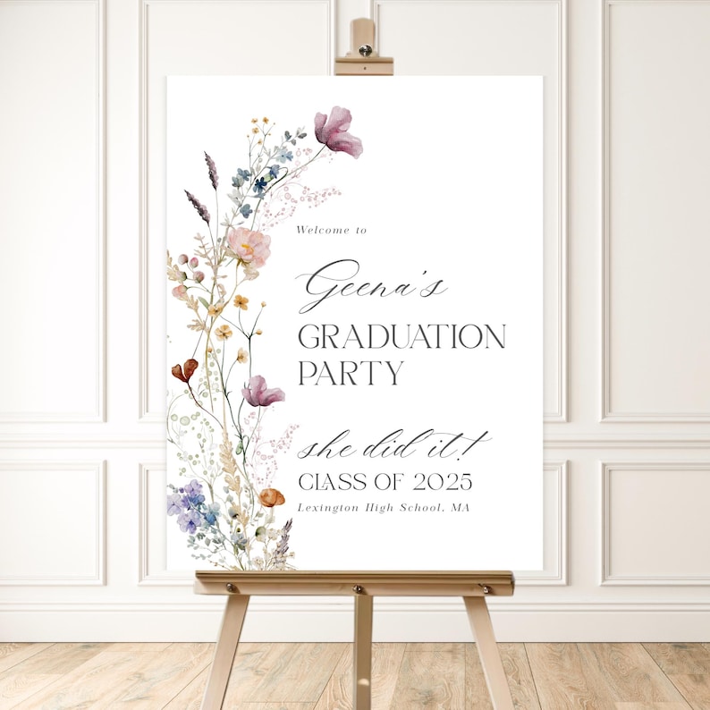 May include: A white sign with a floral border and the text "Welcome to Geena's Graduation Party she did it! Class of 2025 Lexington High School, MA"