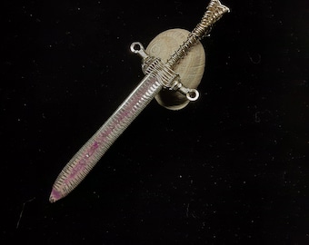 Hand crafted amethyst and opal imbedded glow-in-the-dark and u.v. reactive sterling silver sword pendant.