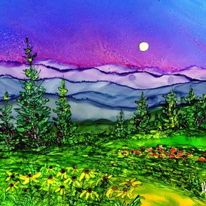 May include: A painting depicting a mountainous landscape at dusk, with a full moon in the sky. The mountains are painted in shades of blue, purple, and pink. The foreground features a field of green grass with yellow flowers and a few trees.