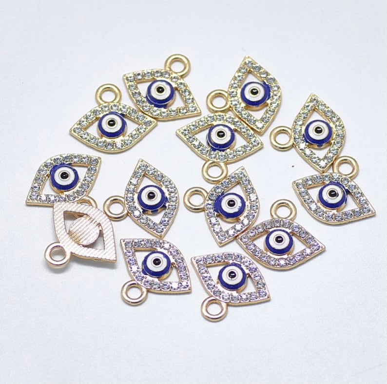 One blue enamel and crystal rhinestone light gold plated evil eye charm pendant for jewellery making